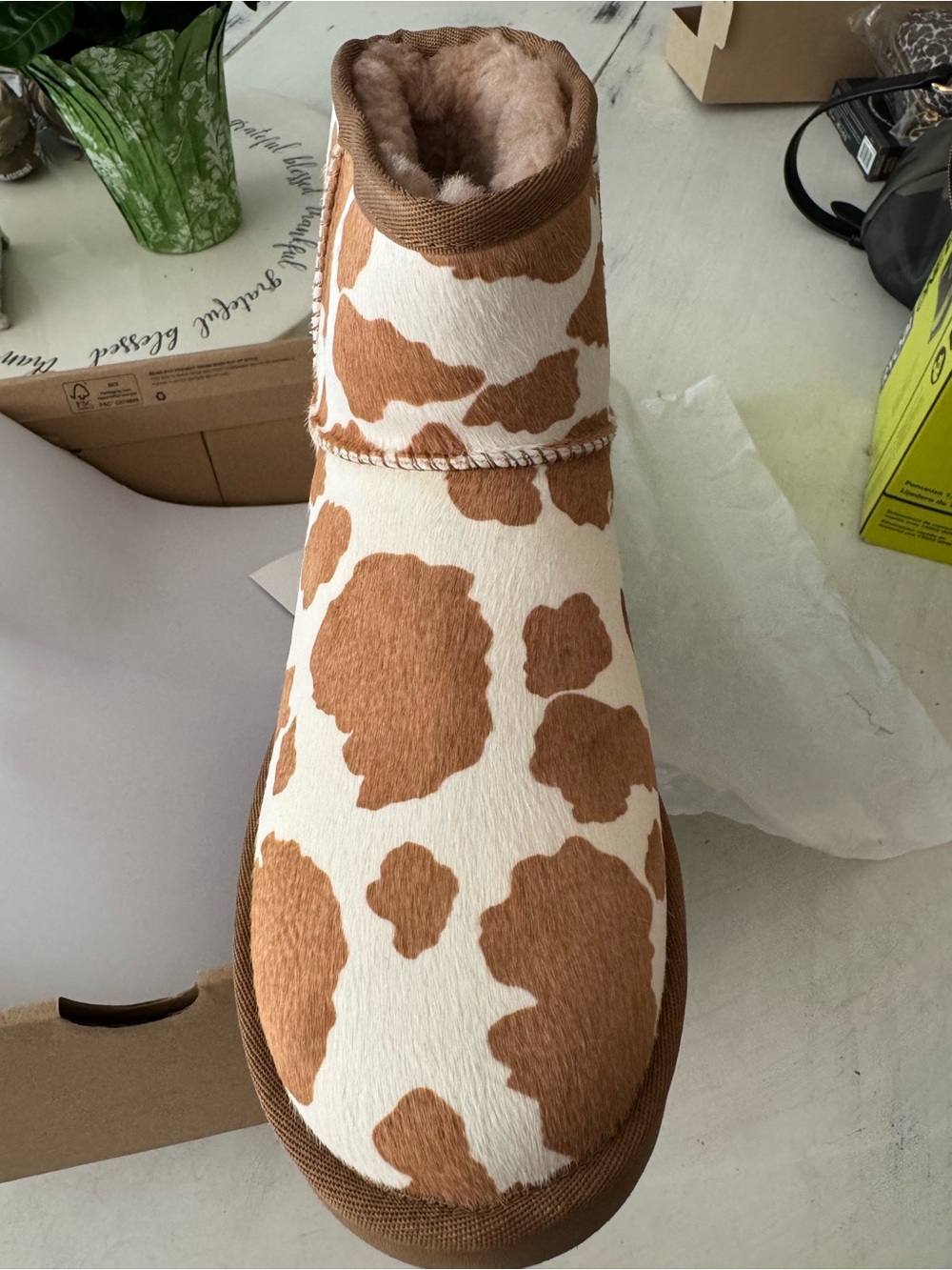 UGG Women's Cow Print Ankle Booties in Brown and White